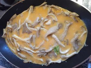 preparing omelet with Oyster Mushrooms © cadwu