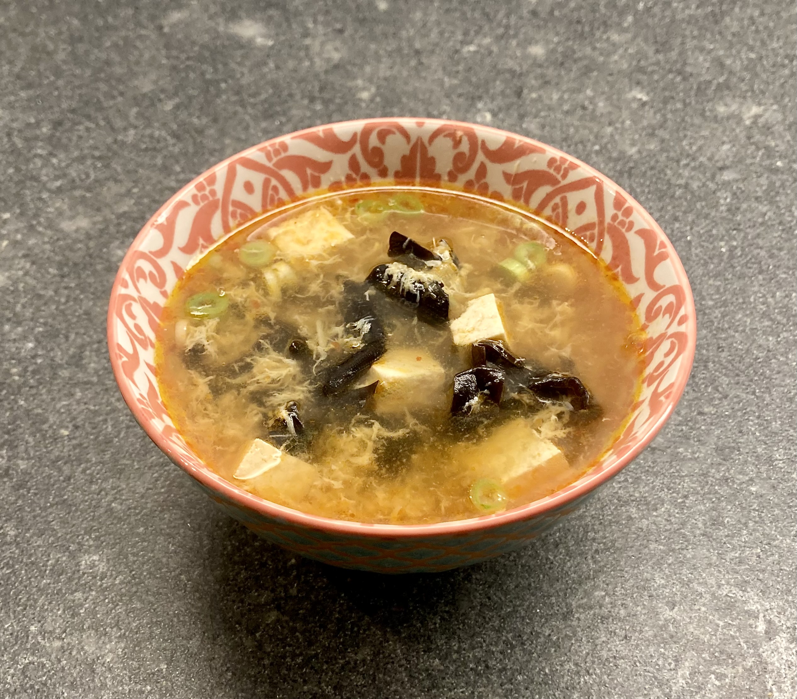 Hot and Sour Soup ©cadwu with wood ear mushrooms, ginger, chili paste, tofu and rice vinegar. Also ribbons of egg