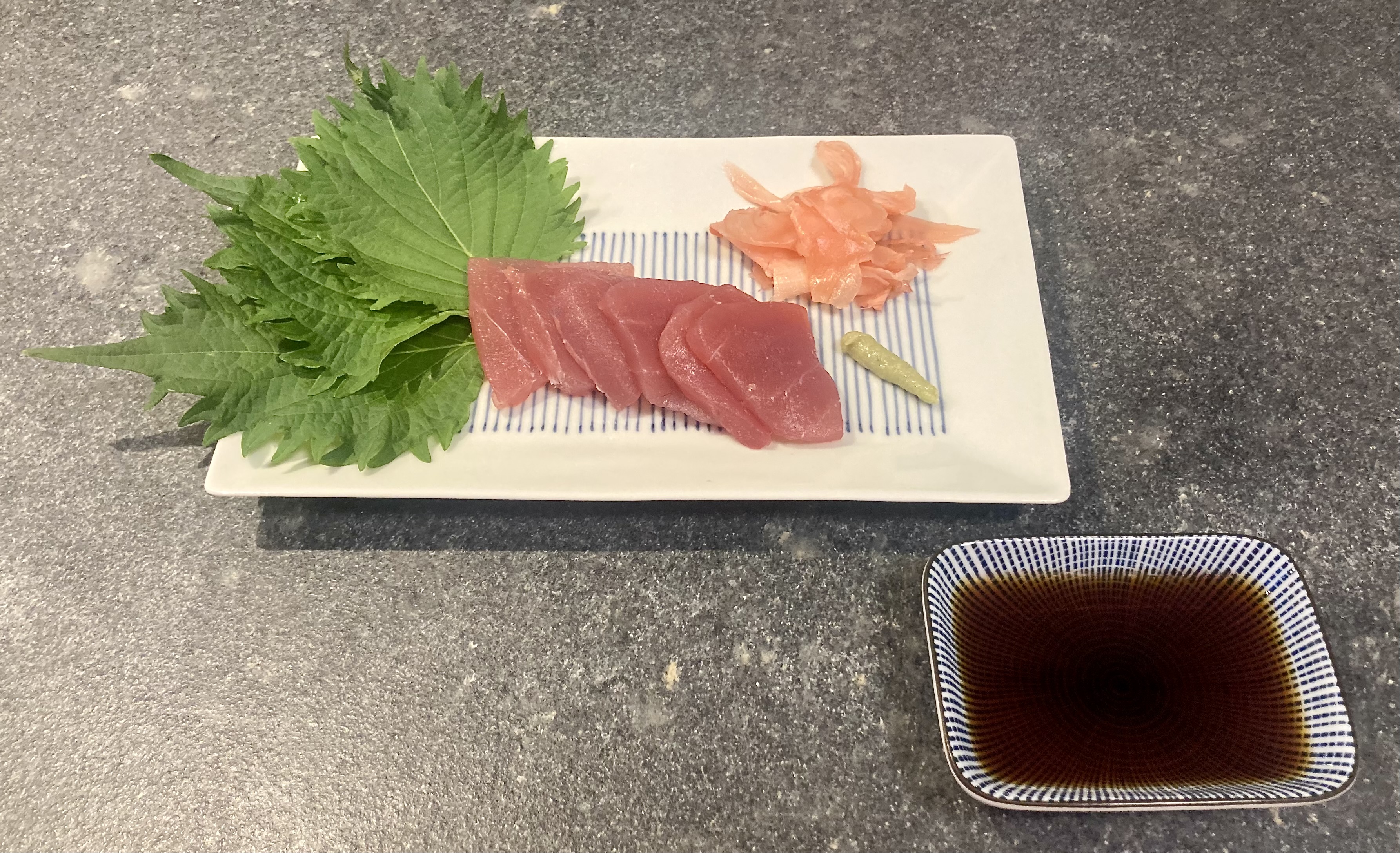 Tentsuyu ©cadwu served with sashimi of tuna, shiso leaves, wasabi and pickled ginger